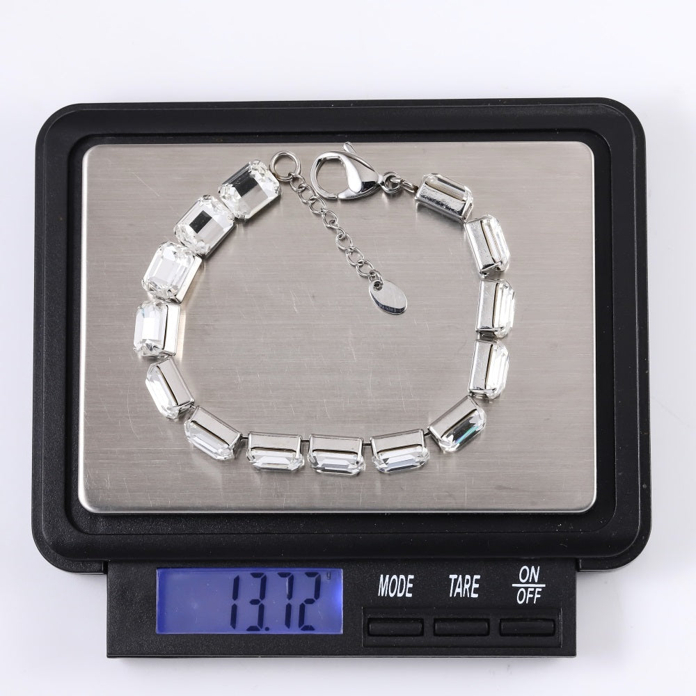 MBSS217 STAINLESS STEEL TENNIS BRACELET WITH EMERALD CUT FOILED STONE