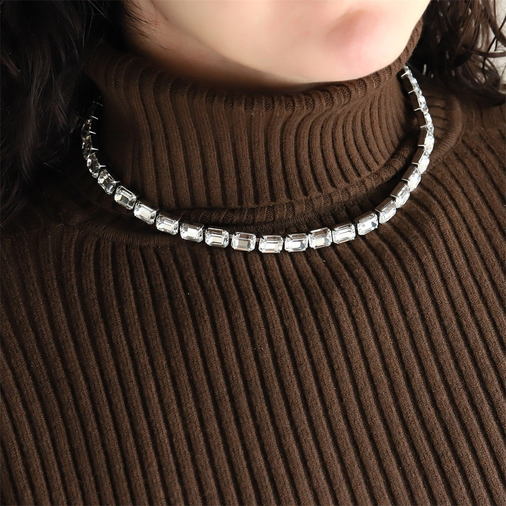 MNSS65 STAINLESS STEEL TENNIS NECKLACE WITH EMERALD CUT FOLED STONE