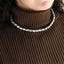 MNSS65 STAINLESS STEEL TENNIS NECKLACE WITH EMERALD CUT FOLED STONE